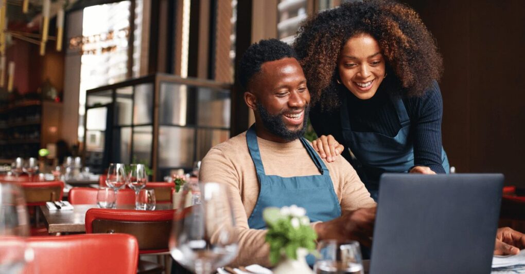 Why Professional Graphic Design Is Essential for Small Businesses in South Africa South African small business owner collaborating on graphic design